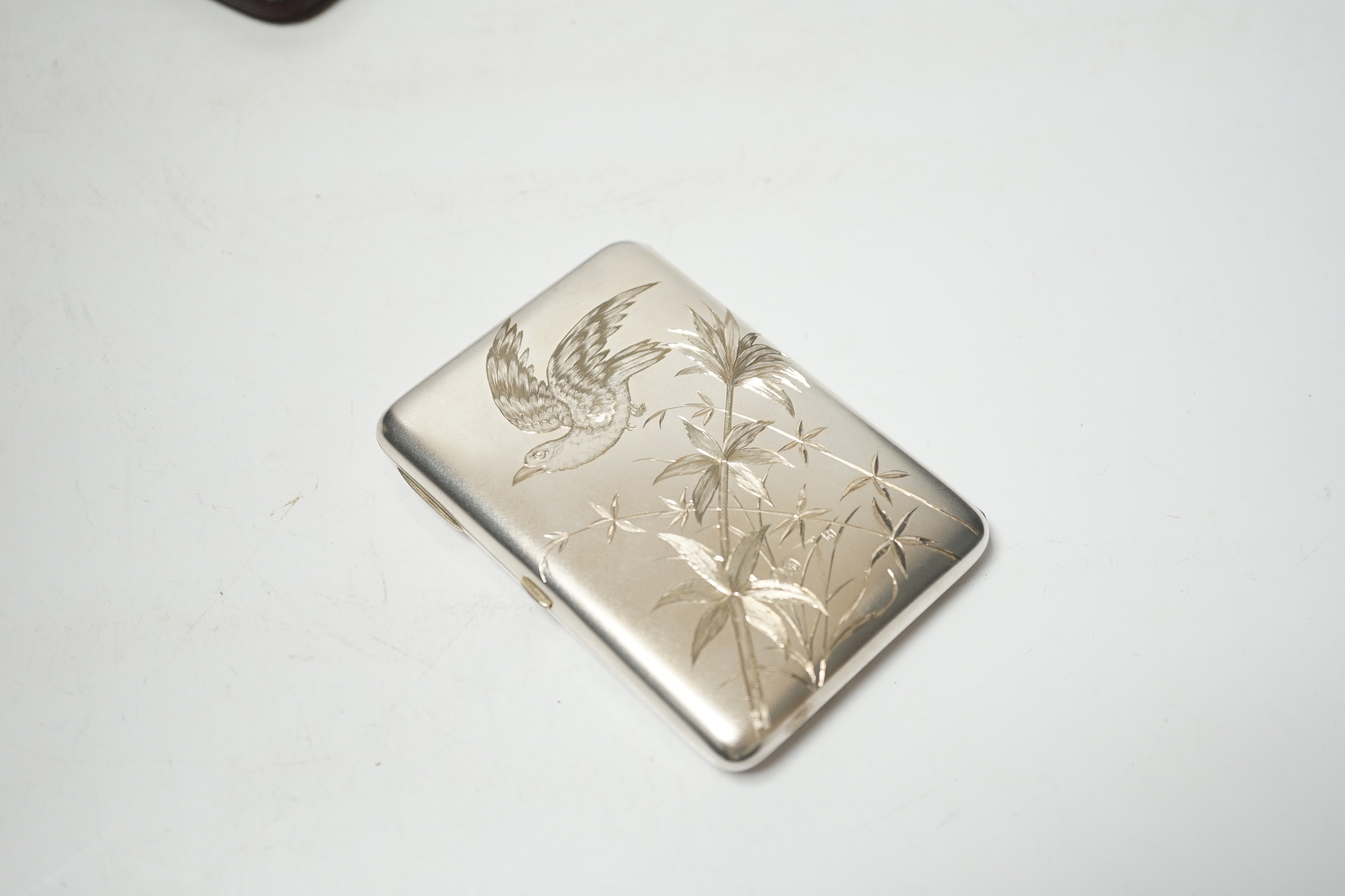 A Victorian aesthetic movement engraved silver card purse, Alfred Hall & John Goode, London, 1885, 10.1cm, in original fitted case.